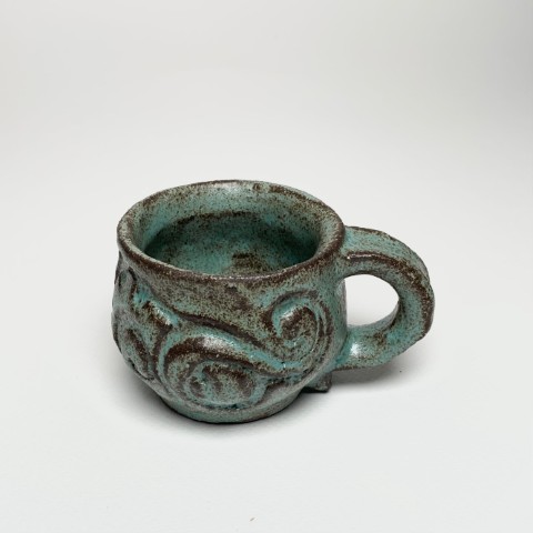 Taza pasta negra esmlate esmeralda. Labrados con esmate también